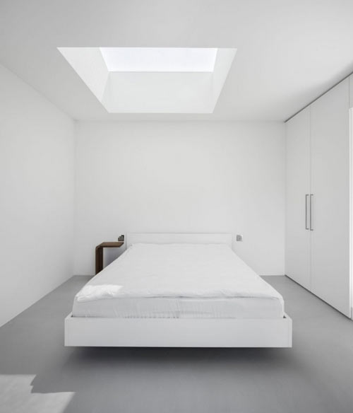 minimalist bedroom white color gray flooring skylight